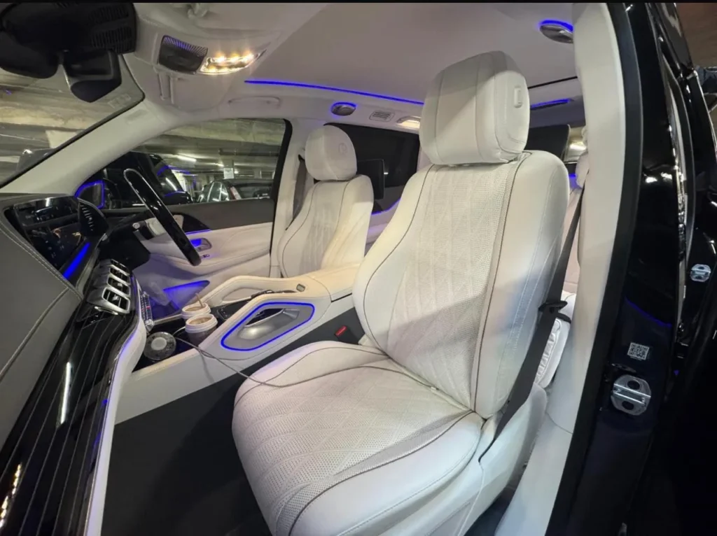 Mercedes-Maybach GLS front cabin with white quilted leather seats and ambient lighting
