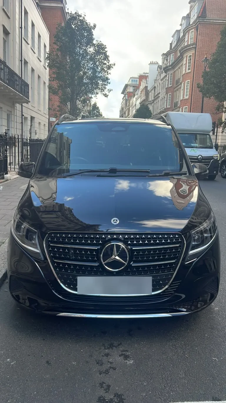Front view of a black Mercedes V-Class chauffeur vehicle on a central London street