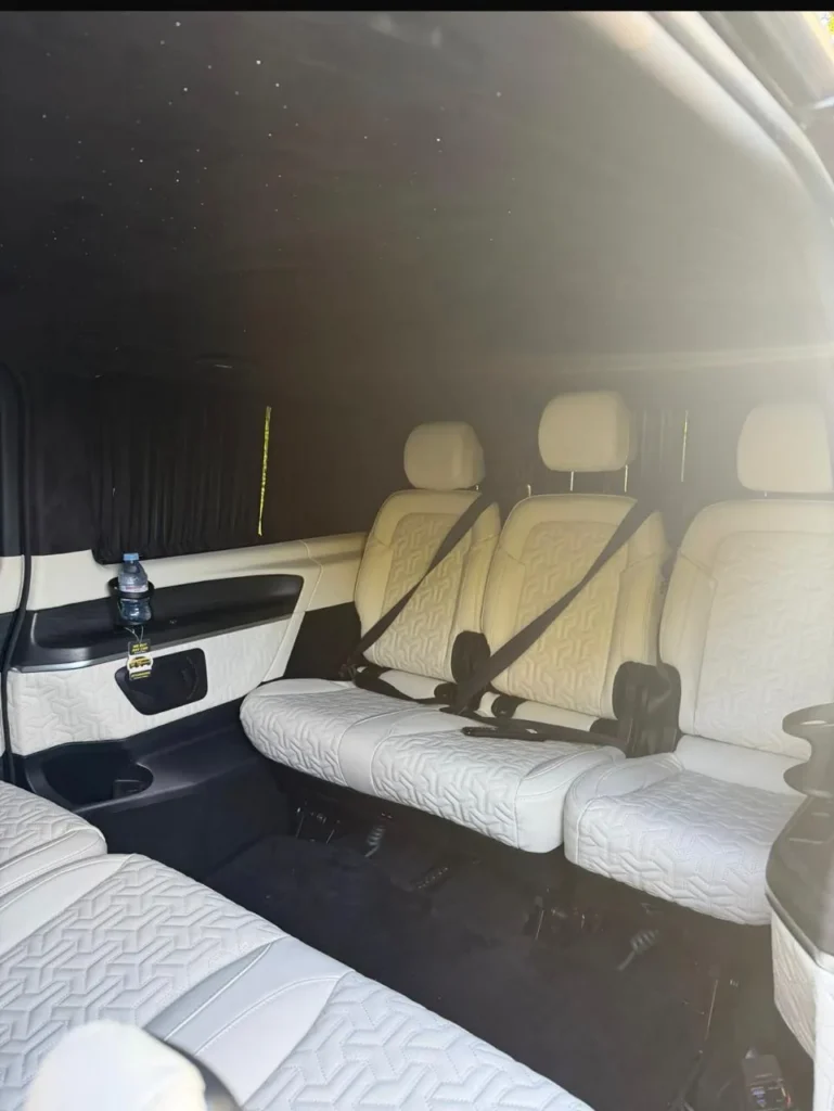 Mercedes V-Class luxury interior with cream quilted leather seats, privacy curtains and starlight headliner