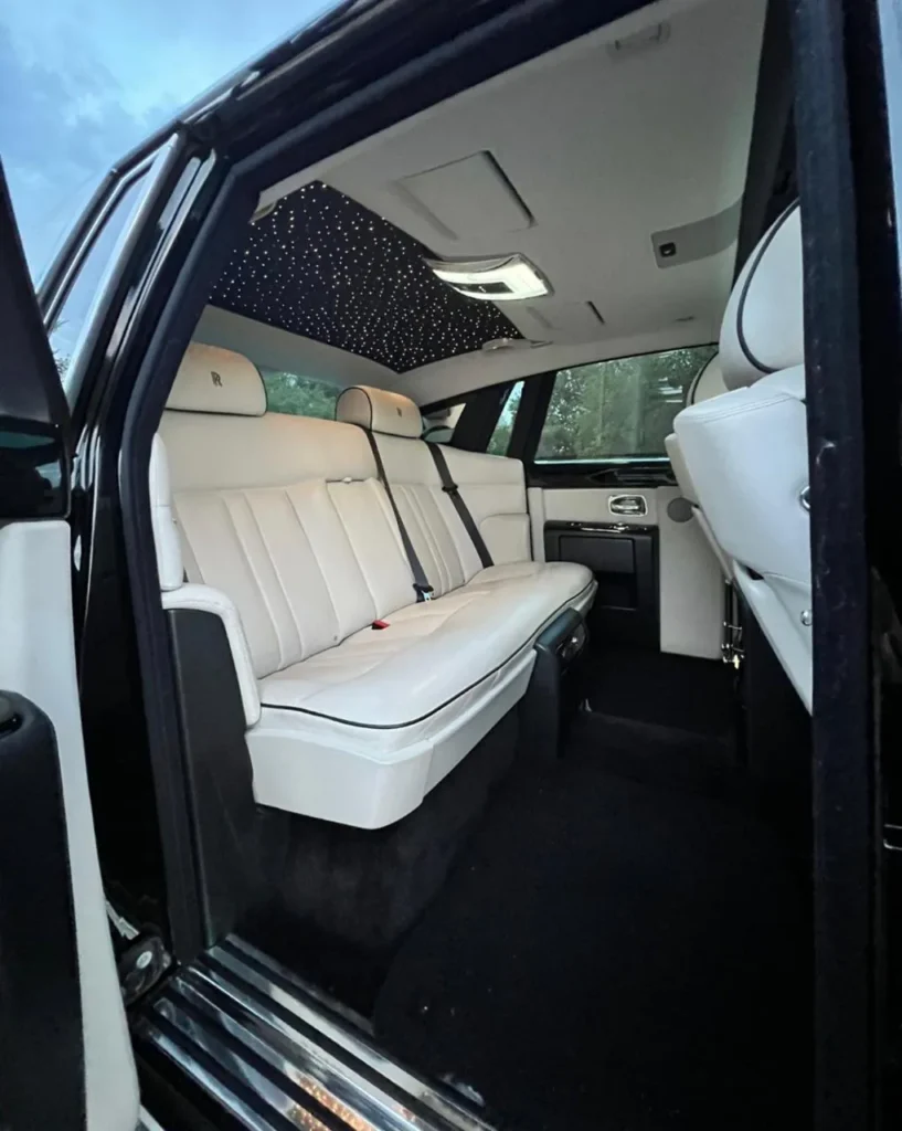 Rolls-Royce Phantom rear cabin with white leather bench seat and starlight headliner